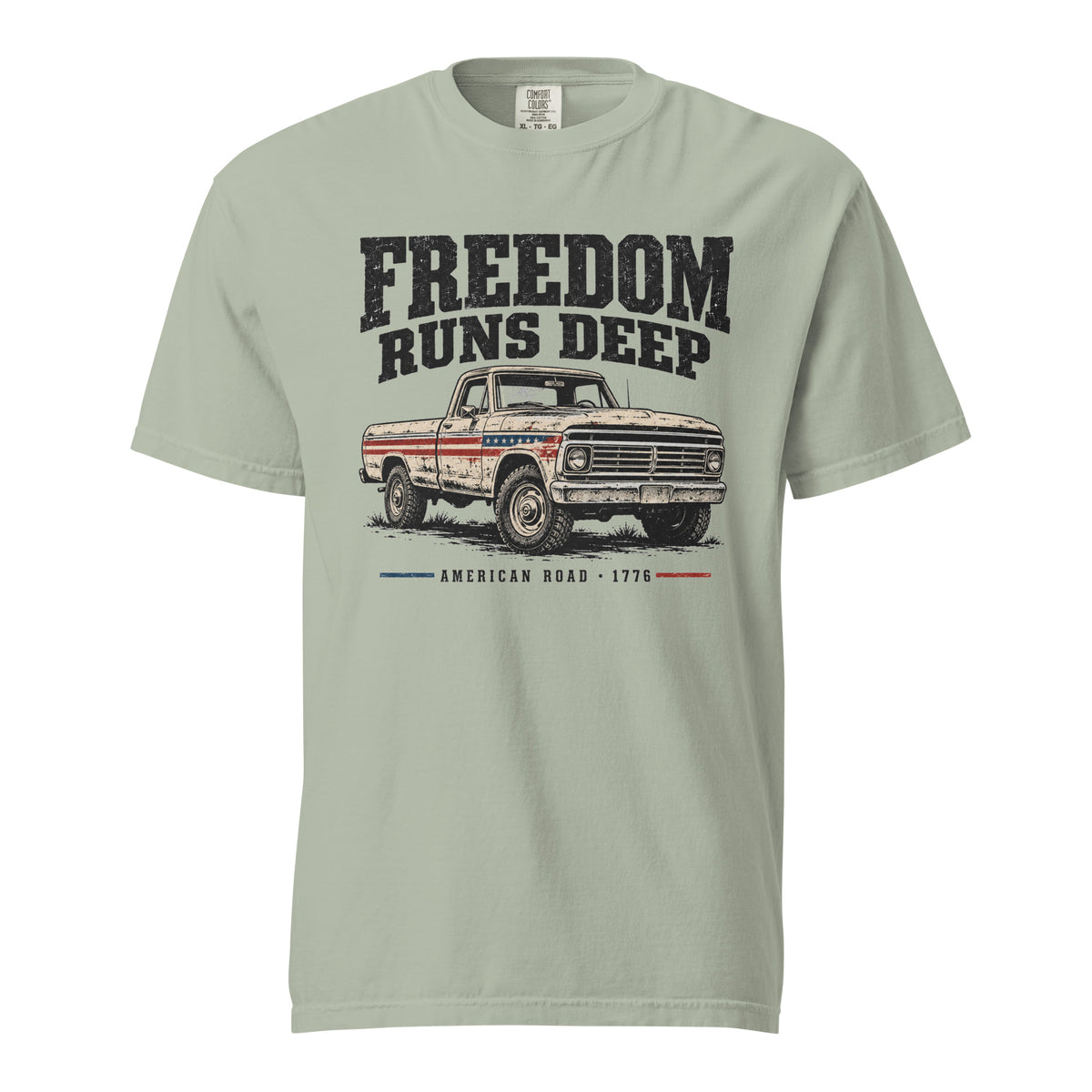 grey men's t-shirt with Freedom Runs Deep written across the top above a vintage American truck 