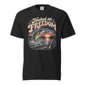 black men's t-shirt with Hooked on freedom written in large vintage lettering, with a sunset and bass graphic 