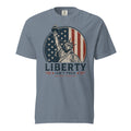Blue men's t-shirt with American flag statue of liberty graphic, and text that says "Liberty isn't free" underneath