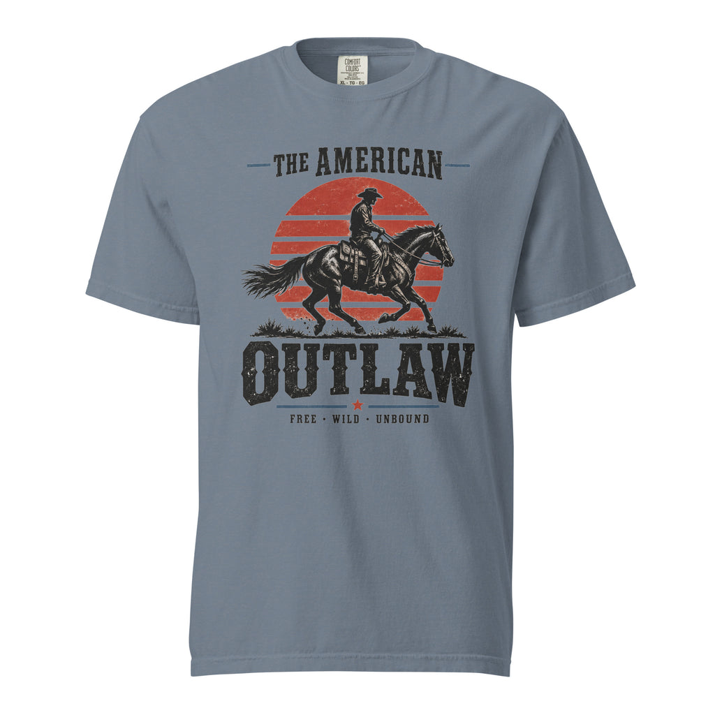 blue men's t-shirt with a sun setting silhouette and cowboy riding horse with "The American Outlaw" written above and below