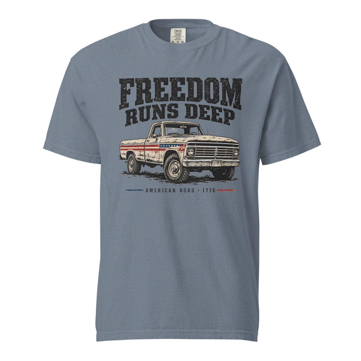 blue men's t-shirt with Freedom Runs Deep written across the top above a vintage American truck 