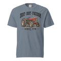 men's blue t-shirt with vintage red tractor graphic, and the words "Dust dirt freedom, since 1776" written above and below