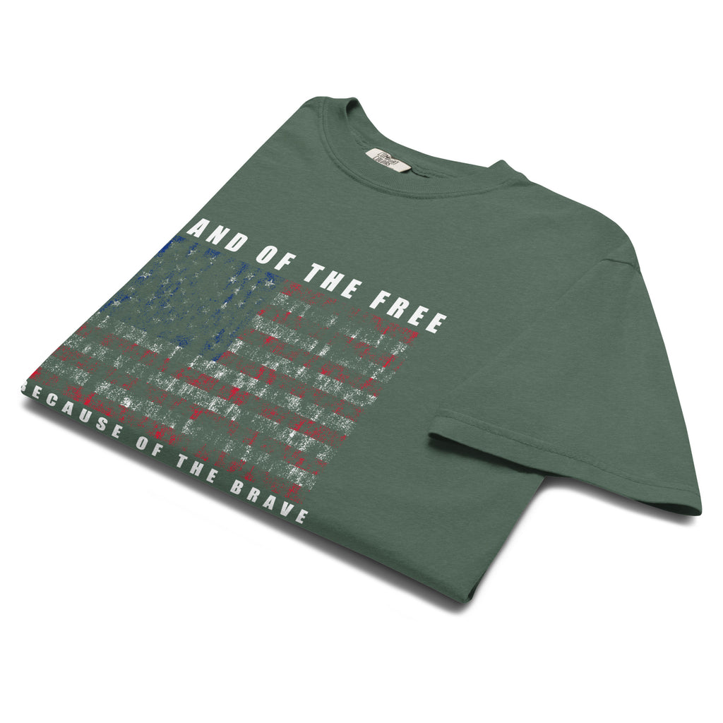 Men's green t-shirt with land of the free because of the brave written above and below a distressed American flag design