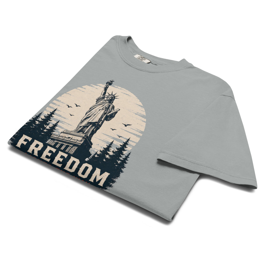 Gray men's t-shirt with statue of liberty and trees, that says "Freedom Lights the way" under it