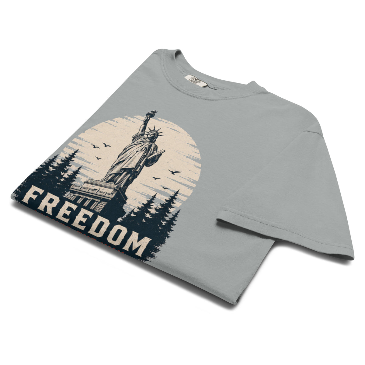Gray men's t-shirt with statue of liberty and trees, that says "Freedom Lights the way" under it