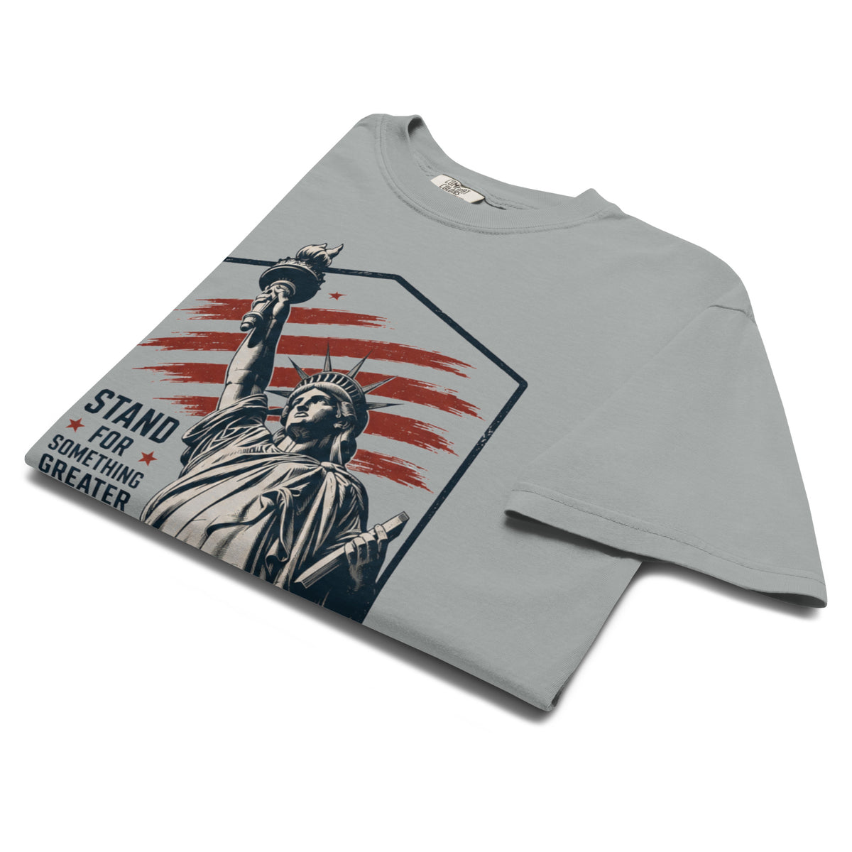 Gray men's t-shirt with statue of liberty and red stripes, that says "Stand for something greater" beside it