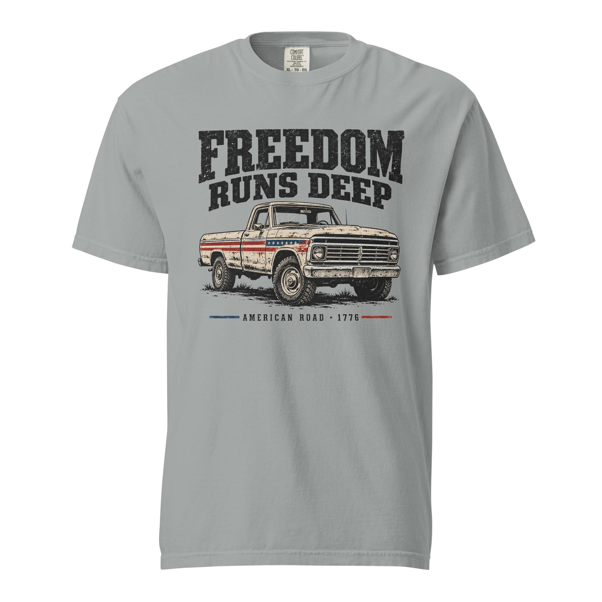 grey men's t-shirt with Freedom Runs Deep written across the top above a vintage American truck 