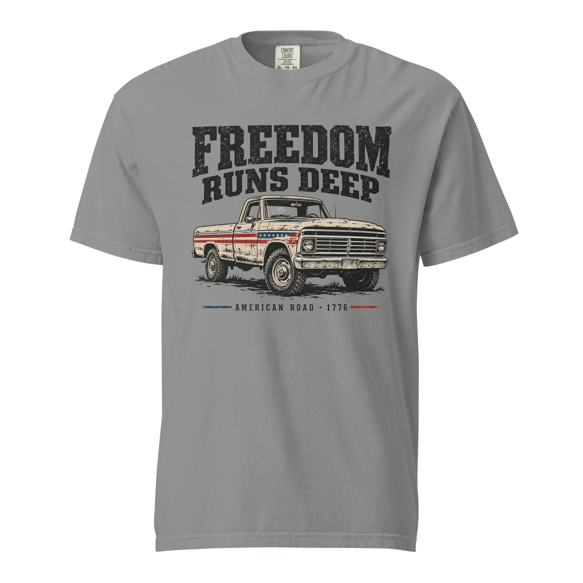 grey men's t-shirt with Freedom Runs Deep written across the top above a vintage American truck 