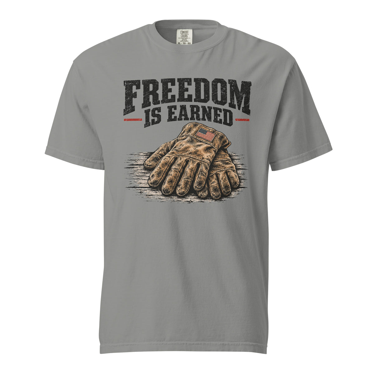 grey men's t-shirt with work gloves on a wooden surface, and above it says "Freedom is earned"