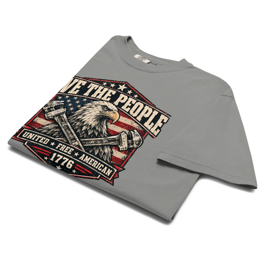 gray men's t-shirt with "we the people" across the top and an eagle with two wrenches graphic below, with written "United Free America" at the bottom