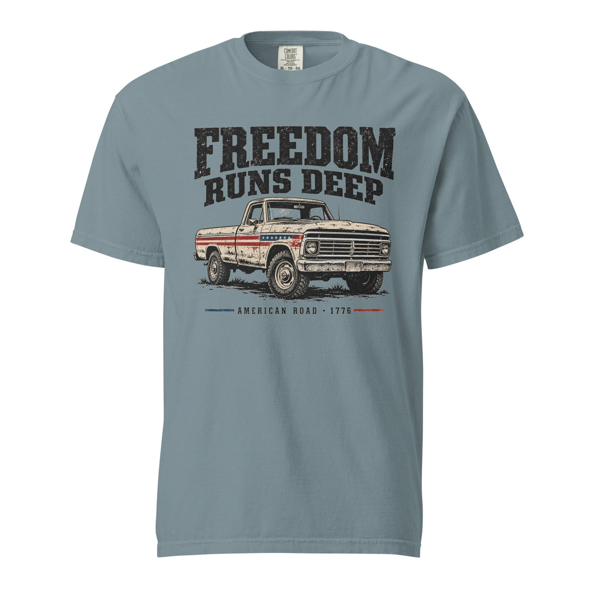 blue men's t-shirt with Freedom Runs Deep written across the top above a vintage American truck 