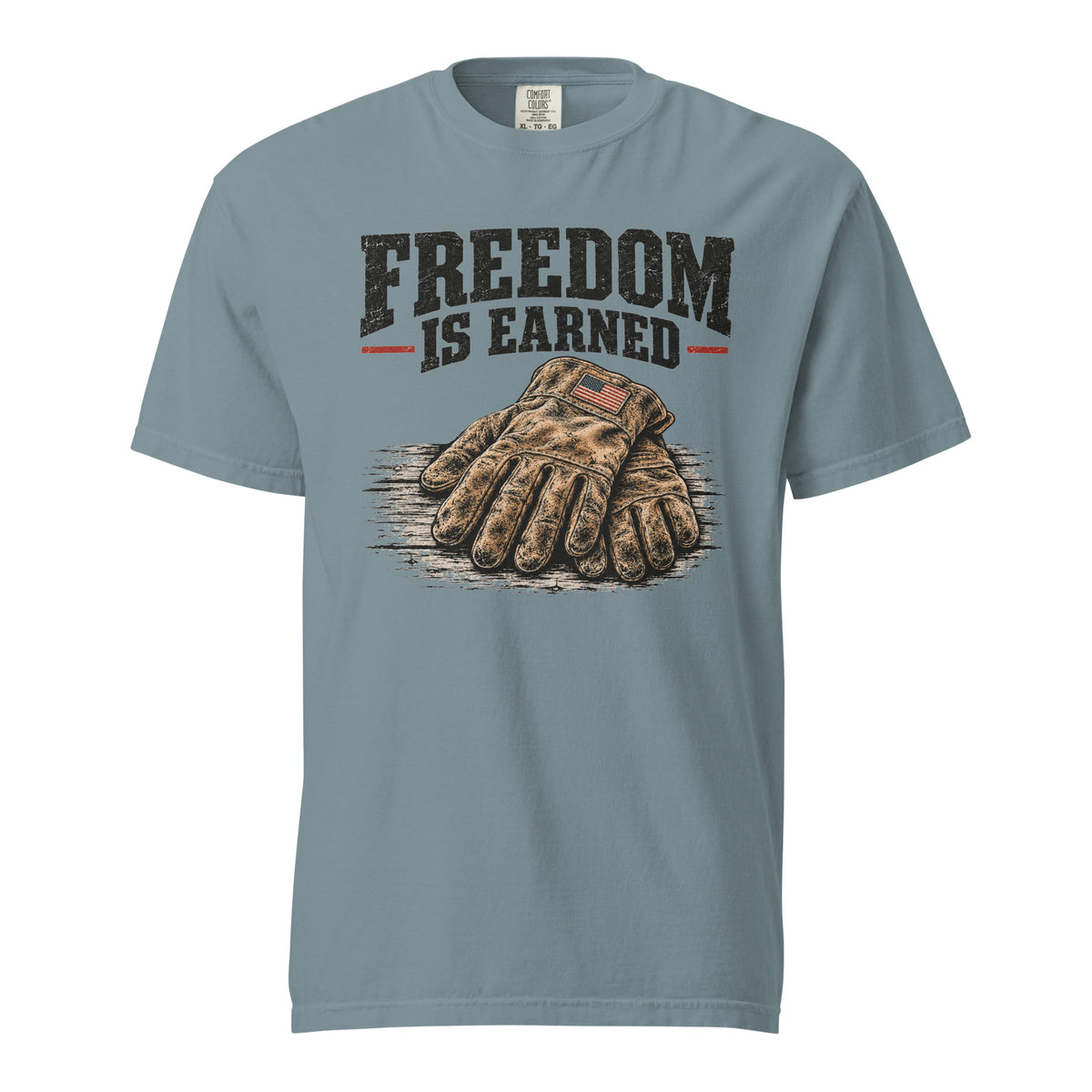 blue men's t-shirt with work gloves on a wooden surface, and above it says "Freedom is earned"