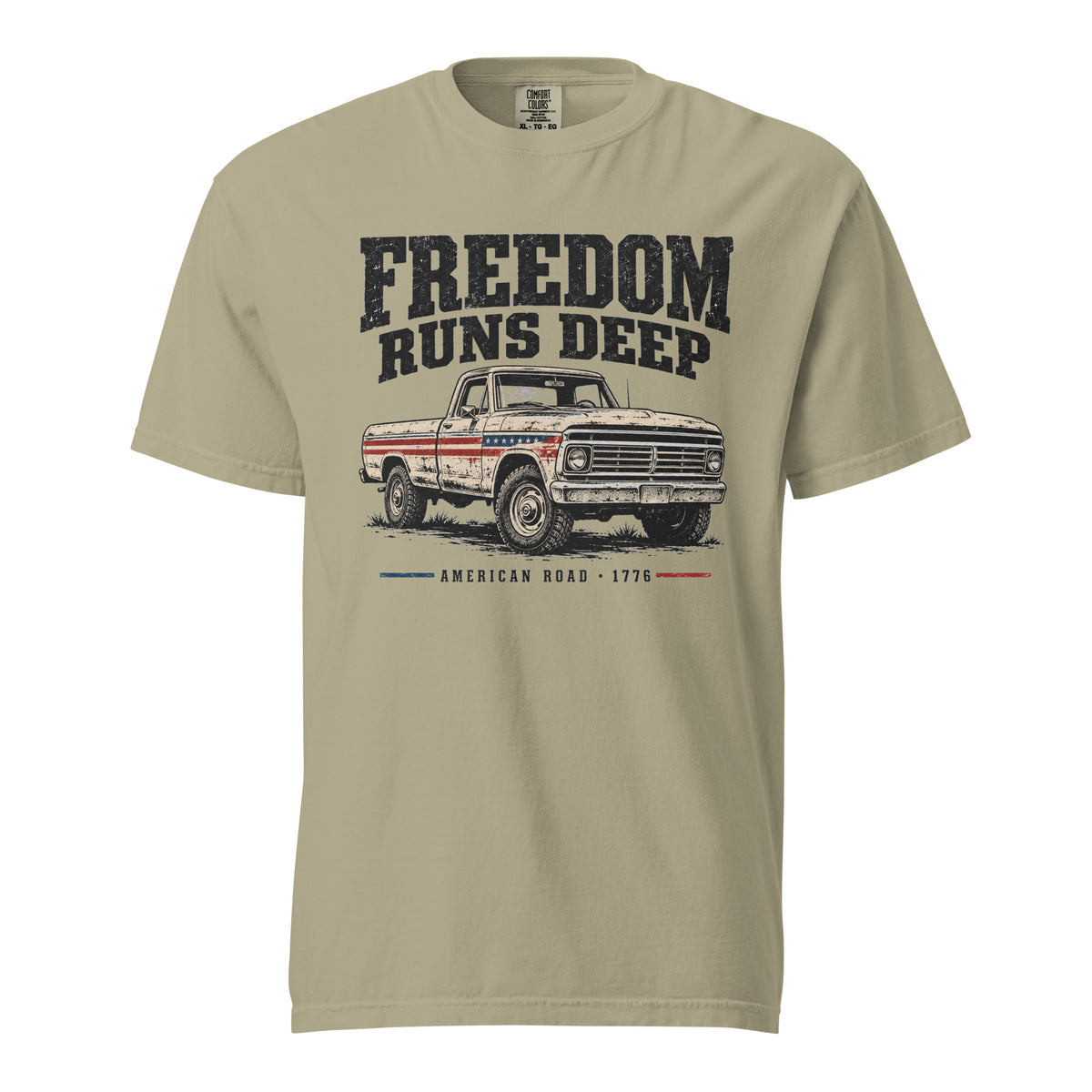tan men's t-shirt with Freedom Runs Deep written across the top above a vintage American truck 
