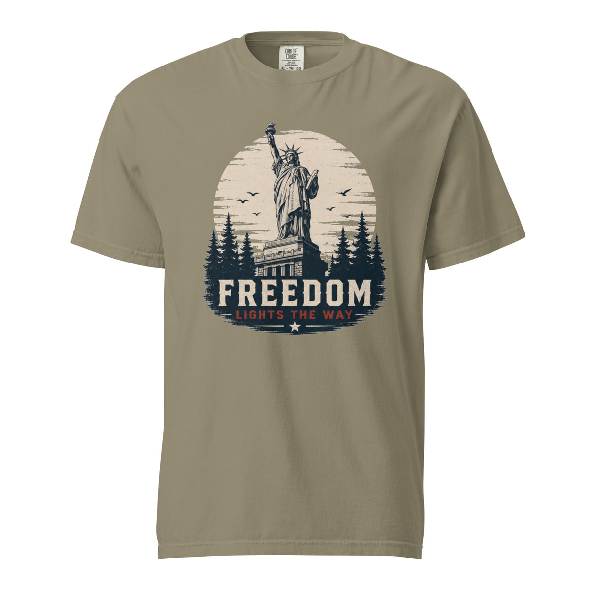 Green men's t-shirt with statue of liberty and trees, that says "Freedom Lights the way" under it