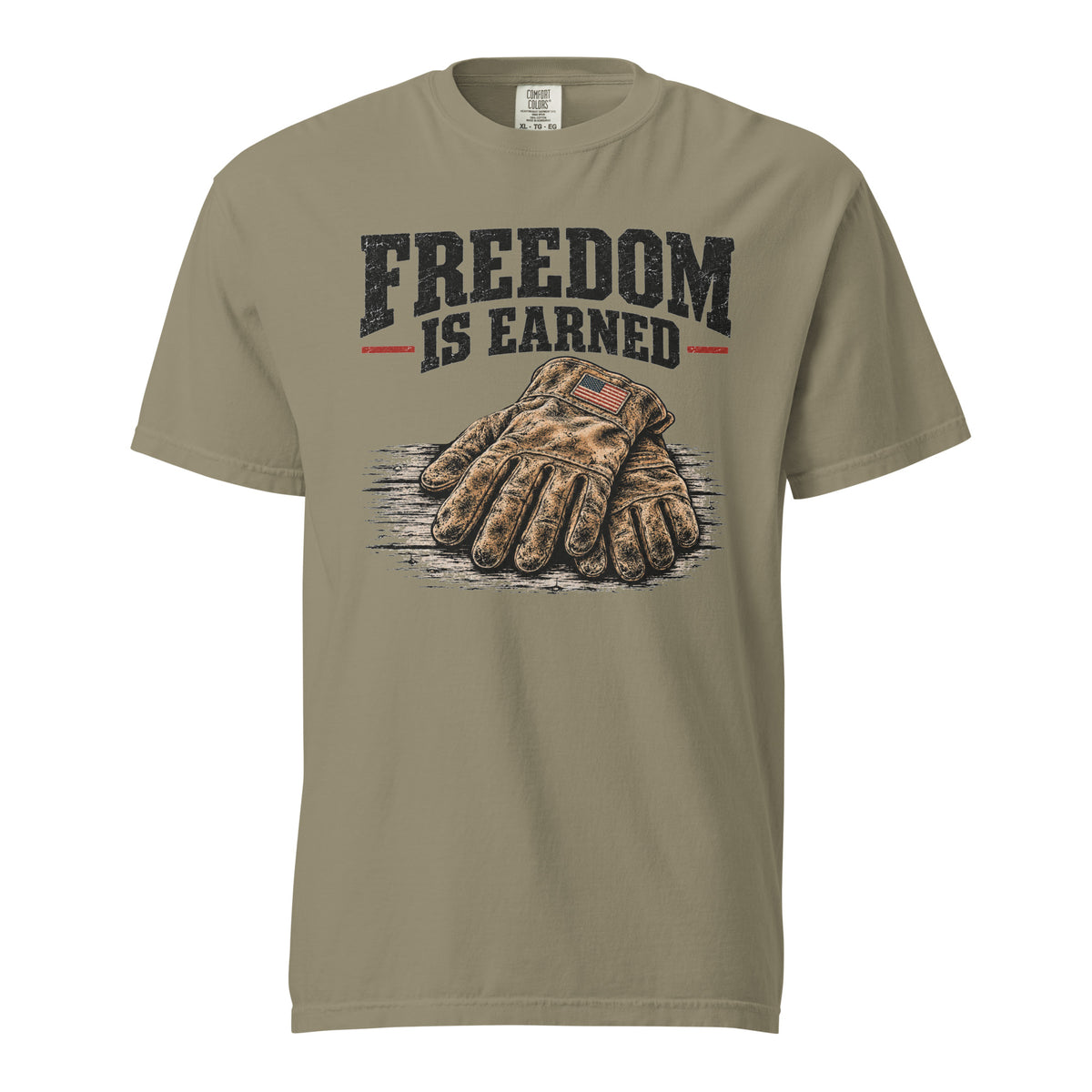 green men's t-shirt with work gloves on a wooden surface, and above it says "Freedom is earned"