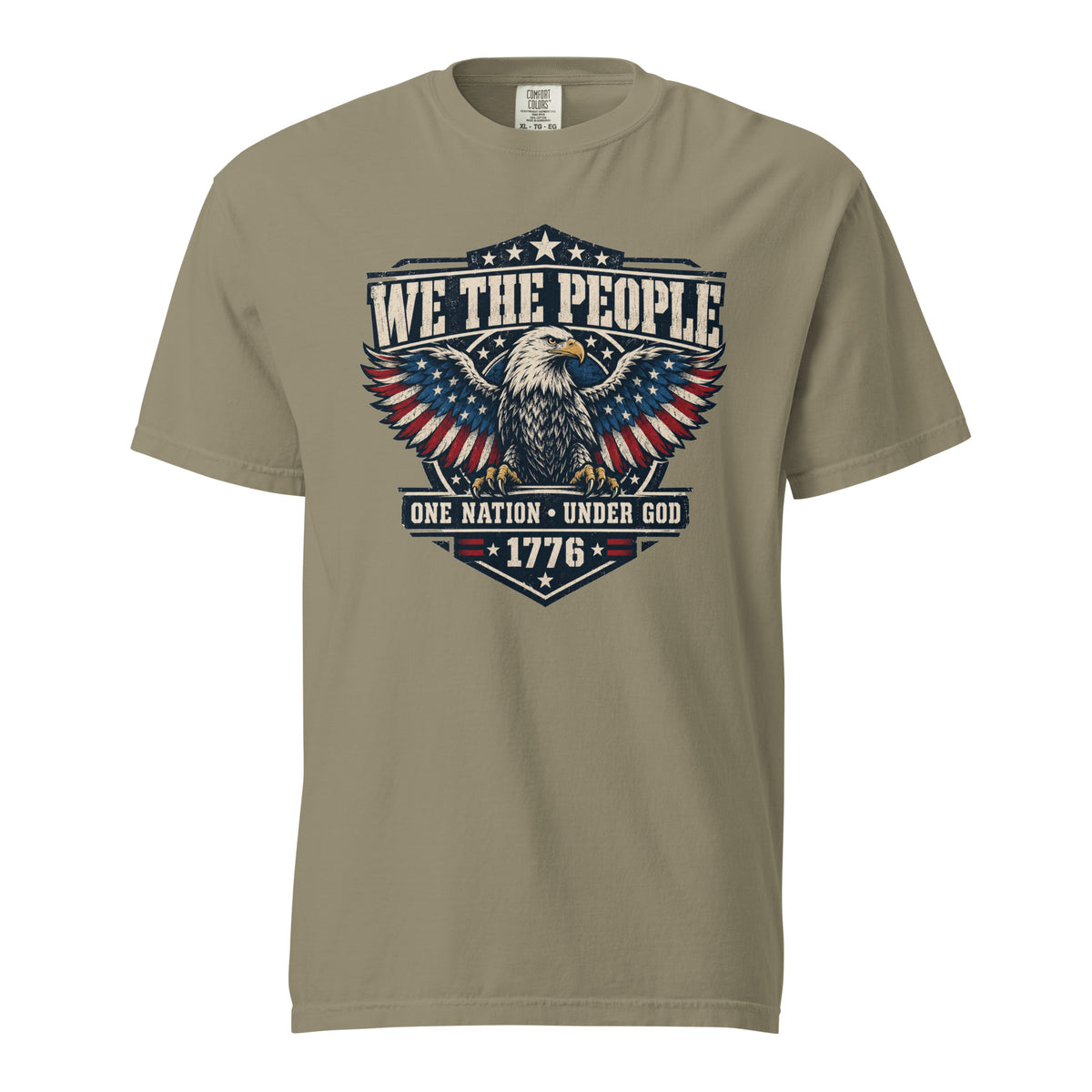 tan men's t-shirt with "we the people" across the top and an eagle graphic below, with written "One nation under god" and "1776" at the bottom