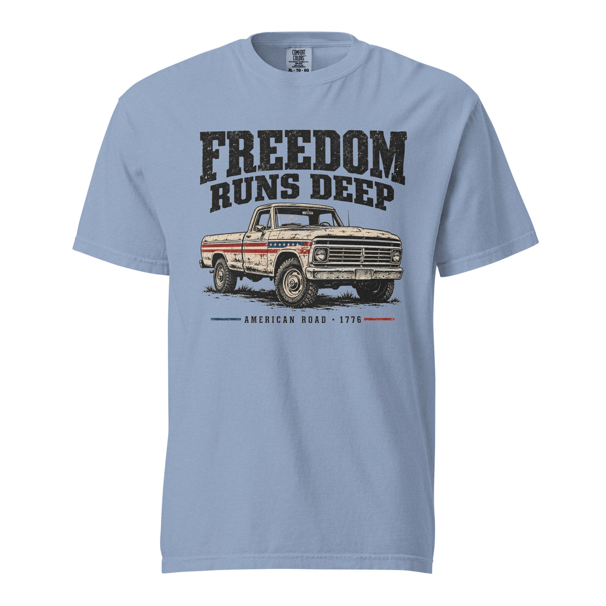blue men's t-shirt with Freedom Runs Deep written across the top above a vintage American truck 