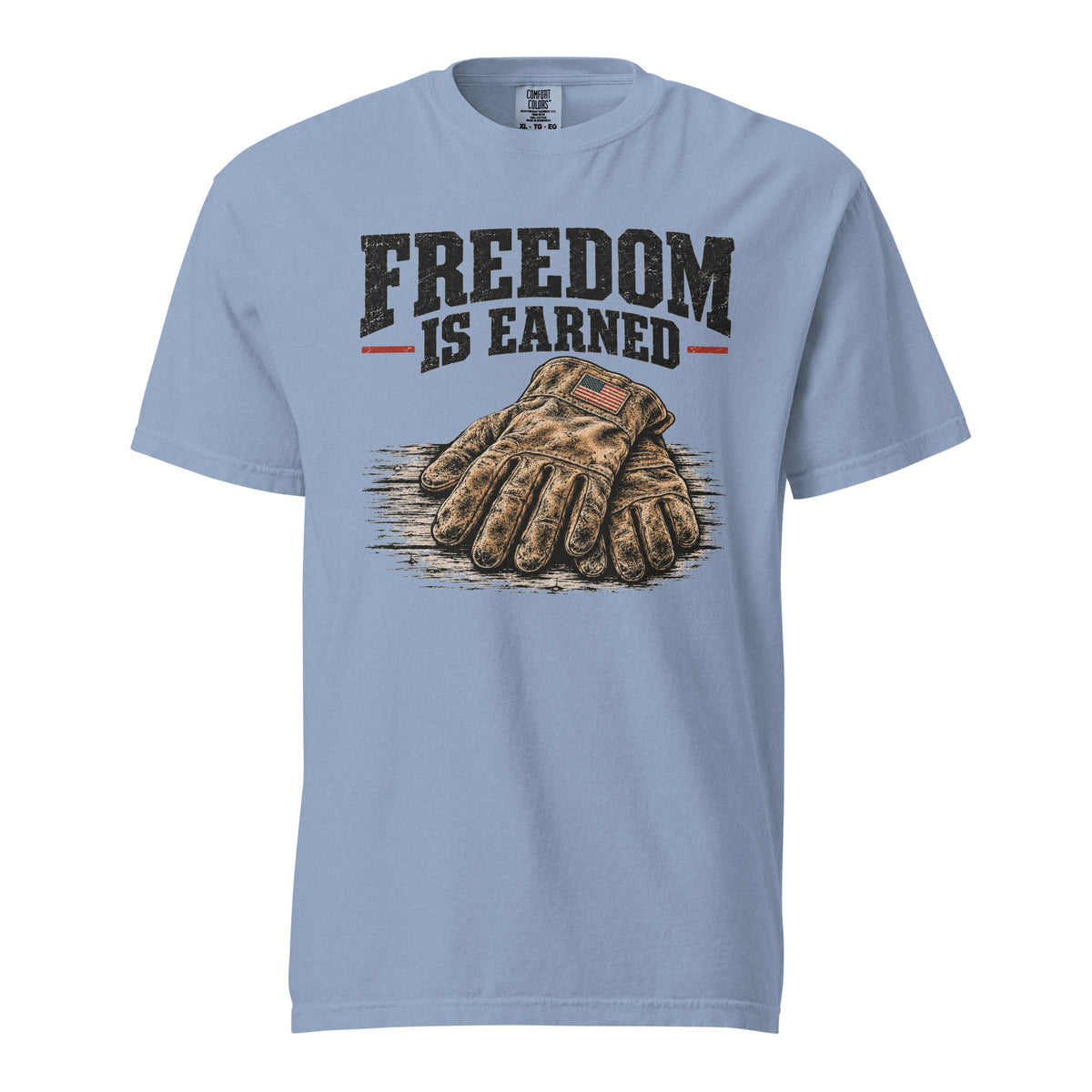 blue men's t-shirt with work gloves on a wooden surface, and above it says "Freedom is earned"