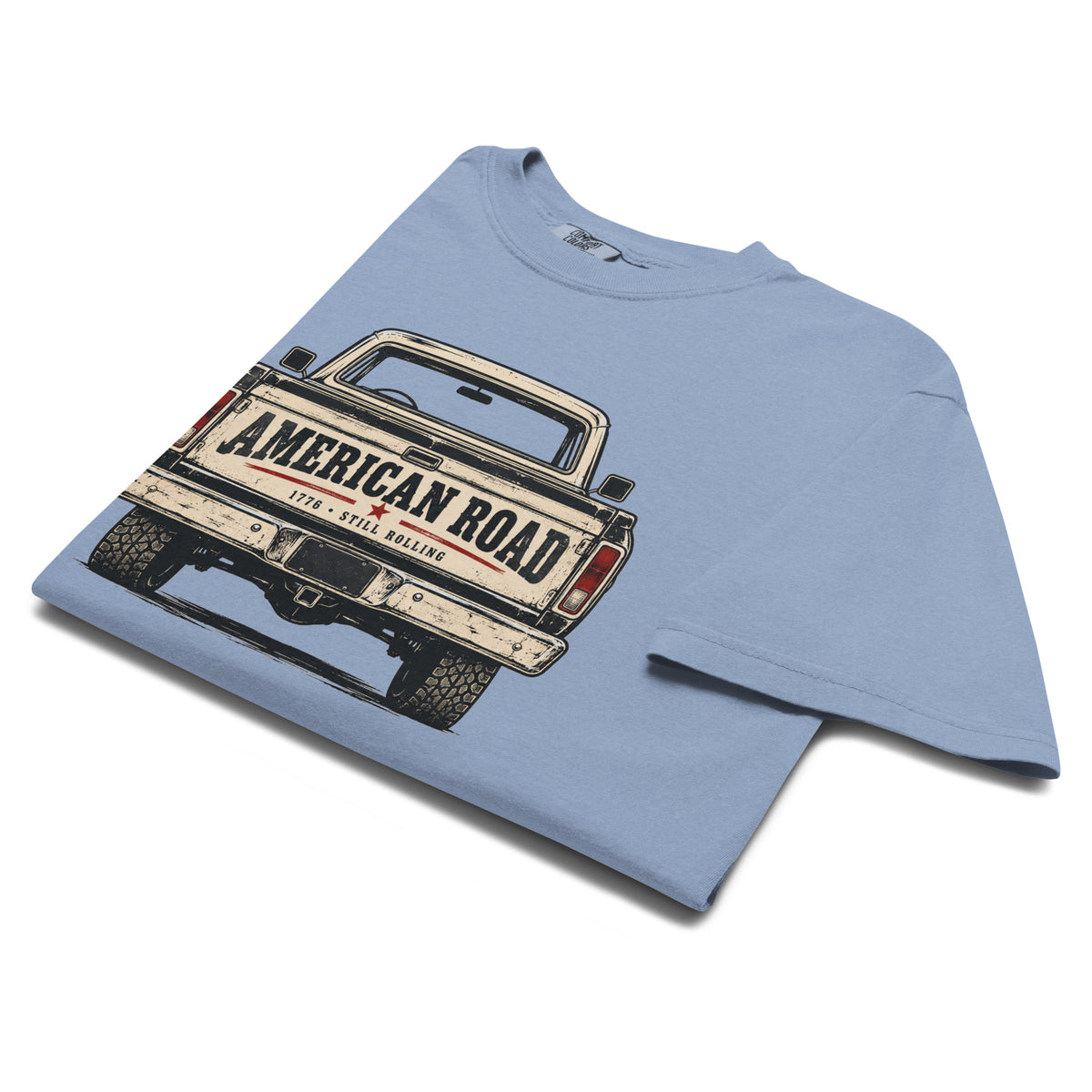 blue men's t-shirt with American Road written across the tailgate of a vintage American truck