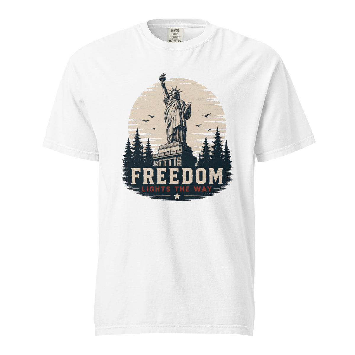 White men's t-shirt with statue of liberty and trees, that says "Freedom Lights the way" under it