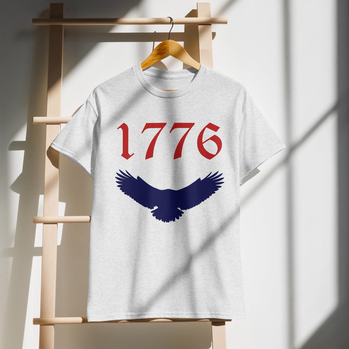 Gray unisex sports shirt with American eagle and 1776 red and blue design