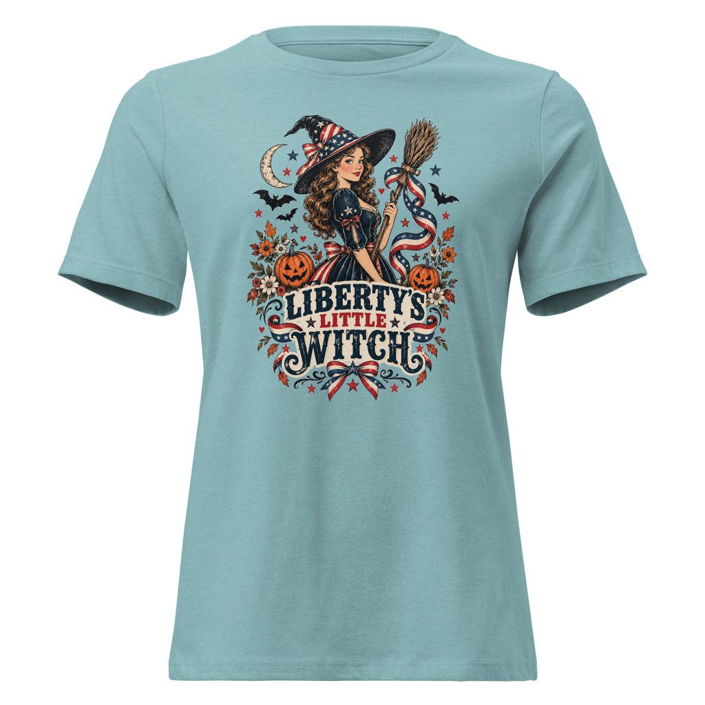 blue women's shirt with American theme witch, and halloween/fall inspired small icons with text saying "Liberty's Little Witch"