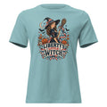 blue women's shirt with American theme witch, and halloween/fall inspired small icons with text saying "Liberty's Little Witch"