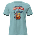 women's blue t-shirt that says "raised on sweet tea and freedom" with American flag and cartoon tea mason jar