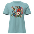 women's blue t-shirt with floral graphic and an American flag with a hummingbird