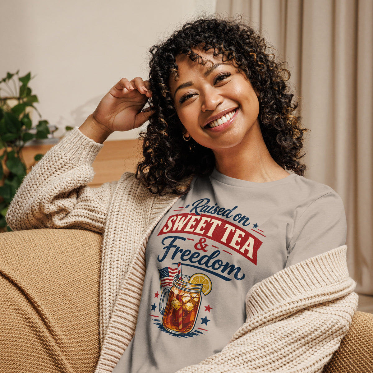 women's tan t-shirt that says "raised on sweet tea and freedom" with American flag and cartoon tea mason jar