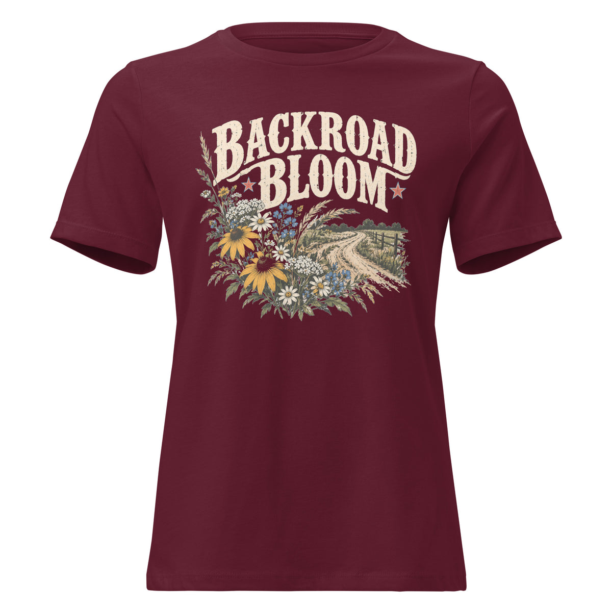 maroon women's shirt with a wildflower graphic and dirt road below the text "backroad bloom"