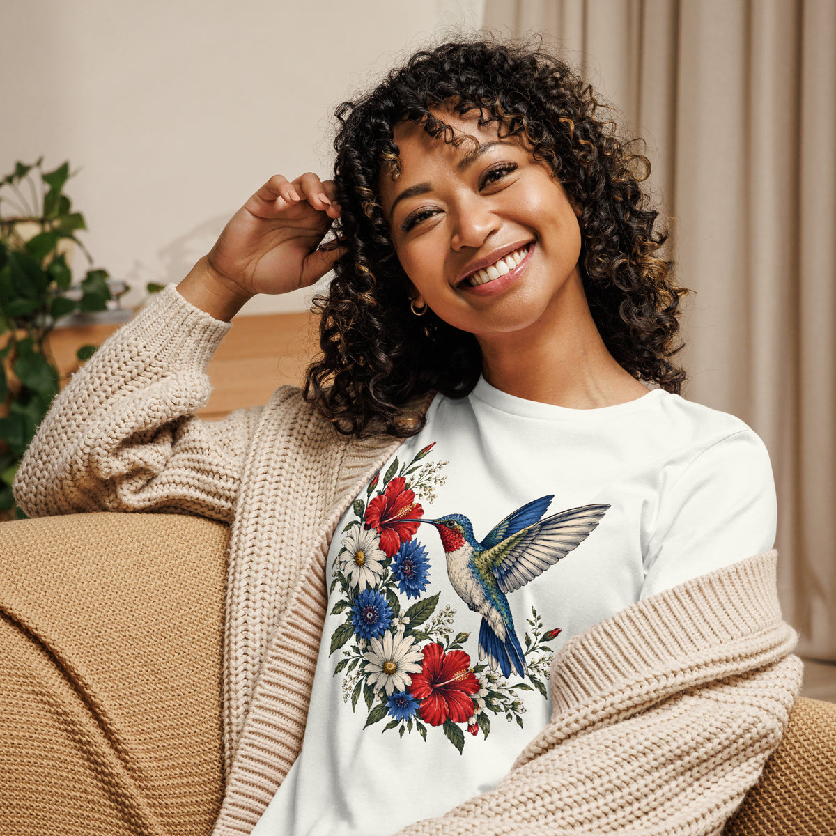 women's white t-shirt with red, white and blue floral graphic and a hummingbird